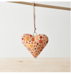 A chic metal heart with a stylish autumn leaves design in rich orange, ochre and brown colours. 