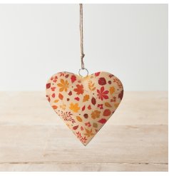 A stylish metal heart with a double sided leaf print in warm autumnal hues. 