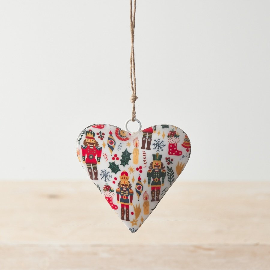 A chic heart shaped decoration with a colourful Nutcracker design decal on both sides. 