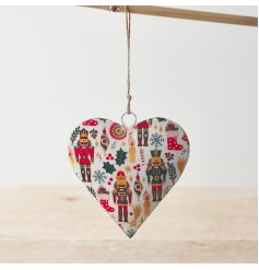 A metal heart decoration with jute string hanger. A colourful seasonal decoration with a traditional nutcracker design.