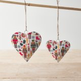 A metal heart decoration with jute string hanger. A colourful seasonal decoration with a traditional nutcracker design.