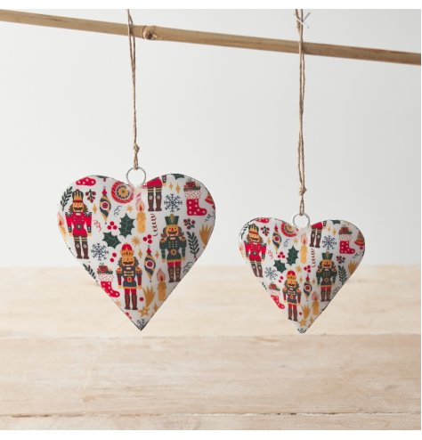 A beautifully detailed nutcracker design hanging heart with jute string. 