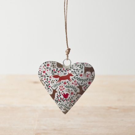 A metal heart hanger with a double sided woodland design including animals, berries and foliage. 