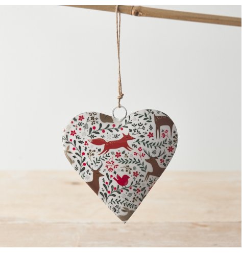 A colourful hanging heart with an intricate seasonal design featuring winter berries and woodland animals. 