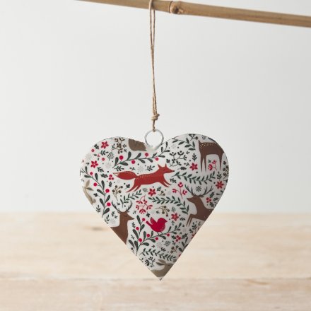 A colourful hanging heart with an intricate seasonal design featuring winter berries and woodland animals. 