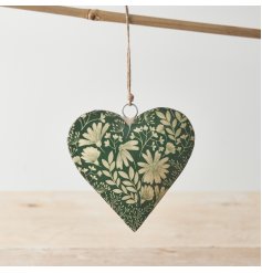 A colourful metal heart decoration with a beautiful botanical design in a rich green hue. 