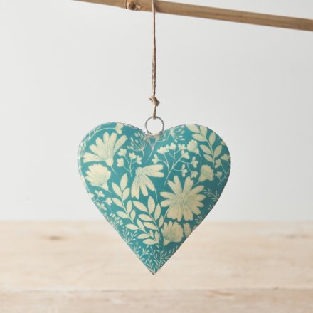 A chic metal heart decoration with a jute string hanger and floral design. 