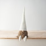 A charming neutral gonk wearing a oversized corduroy white hat and matching boots.