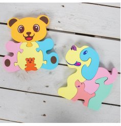 an assortment of 2 brightly coloured animal puzzles, each with a miniature animal pieced inside