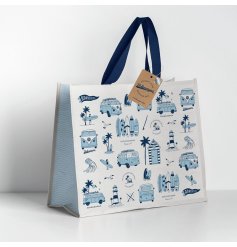 A blue and white shopper bag with various beach and camper images.