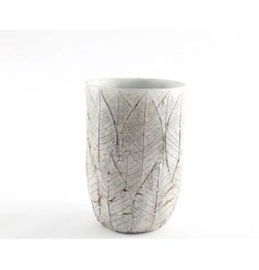 A woodland inspired cement vase with a rustic styled leaf embossed detail