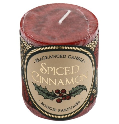A spiced cinnamon small pillar candle in a mottled design.