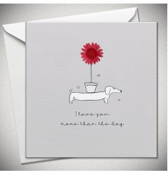 A humorous yet romantic card featuring a sausage dog balancing a flower pot with wording.