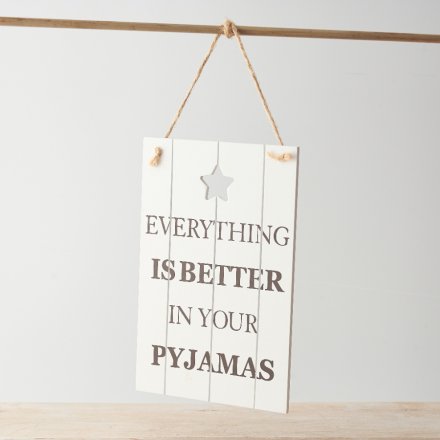 A shabby chic wooden plaque featuring a bold scripted text decal with a cut out star motif.