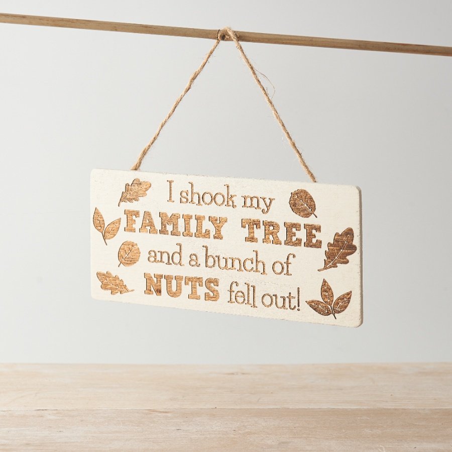 A fun hanging plaque featuring various acorns and leaves and humorous scripted wording