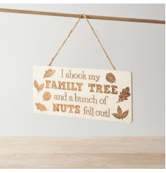 A hanging natural tone plaque displaying a comical text decal.