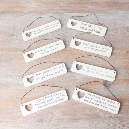 An assortment of 8 mini hanging signs, each with a sentimental message and a cut out heart motif.