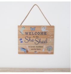 'Welcome to the she shed', a humorous hanging plaque with garden print images and bold scripture.