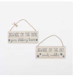 An assortment of 2 wooden hanging signs displaying funny slogans about cats and dogs. 