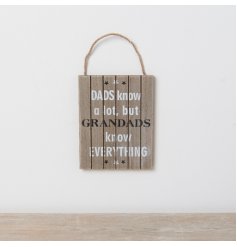 A ''Dads know a lot but Grandads Know Everything'' rustic wooden plaque with star motifs hung from jute twine.