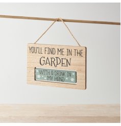 An assortment of 2 wooden signs with quirky writing hung by twine.