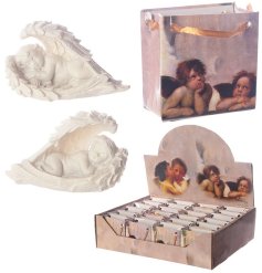 A delicate cherub asleep in a pair of angel wings, supplied with a angel design gift bag