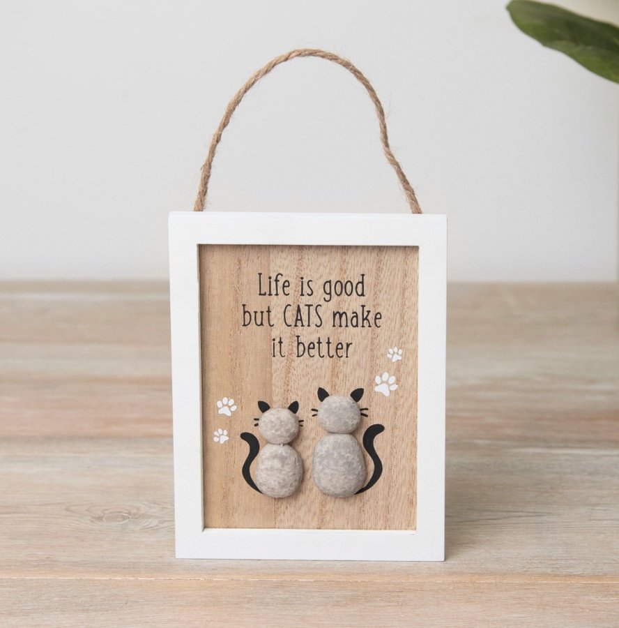 A charming wooden cat sign featuring two pebble cats, pawprints and text