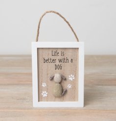 A wooden hanging sign displaying 'Life is Better with a Dog' text and a dog made from pebbles.