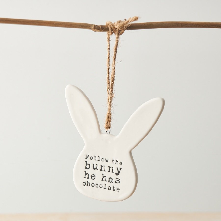 Follow the bunny he has chocolate. This unique bunny shaped porcelain sign is a must have for all seasonal baskets 