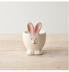 An adorable bunny shaped egg cup with pink ears. A fantastic seasonal gift item, ideal for chocolate and dippy eggs!