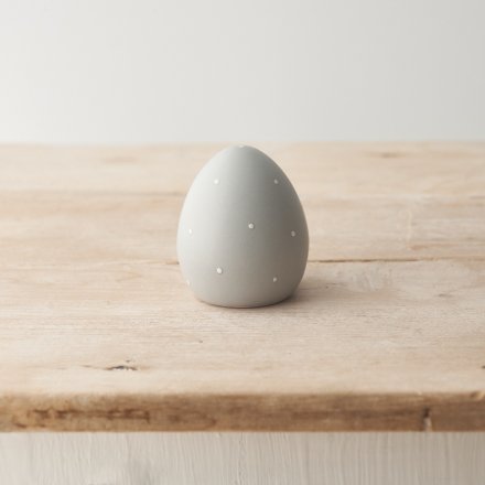 A chic grey and white polka dot egg decoration. A unique and stylish seasonal interior accessory and gift item. 