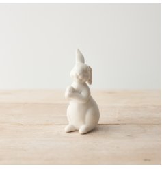 A charming porcelain rabbit with a white glossy finish. 