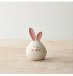 A chic ceramic bunny ornament. Cute and charming with pink glazed details. 