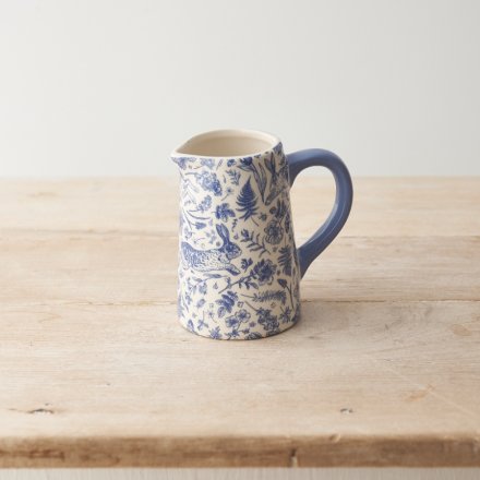 A fine quality jug with a whimsical floral and fauna design in a rich blue hue. A stylish seasonal gift item 