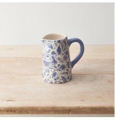 A charming country style jug in a rich blue hue. Featuring an abundance of flowers, leaves and hares. 