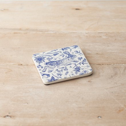 Protect surfaces with this beautifully detailed ceramic coaster featuring a jumping hare and seasonal flowers and leaves