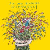 A greeting card displaying arms wrapped round a bunch of flowers with 'You are Blooming Gorgeous' writing above.