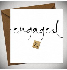 Celebrate the newly engaged with this simple card complete with a wooden scrabble 'X'.