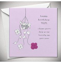 A lovely greeting card for a Mum. A purple card with a simple monochrome hanging basket filled with a hydrangea plant. 