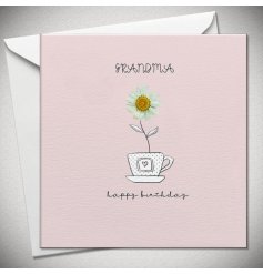 A pastel pink birthday card for a Grandma. The card details a cup and saucer with a flower bursting out the top. 