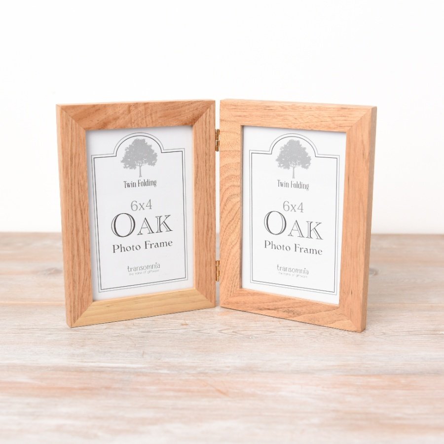 A folding twin display photo frame with room for a 6x4" image and chunky oak frame. 