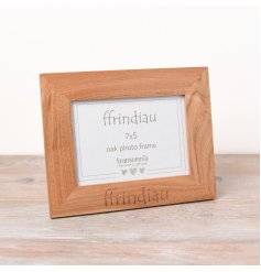 A beautifully natural oak frame engraved with Ffrindiau which is Friends in welsh.