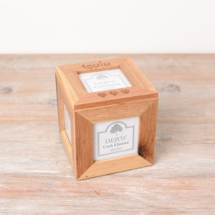 A chunky wooden box frame photo cube with heart details and "Family" text in Welsh.