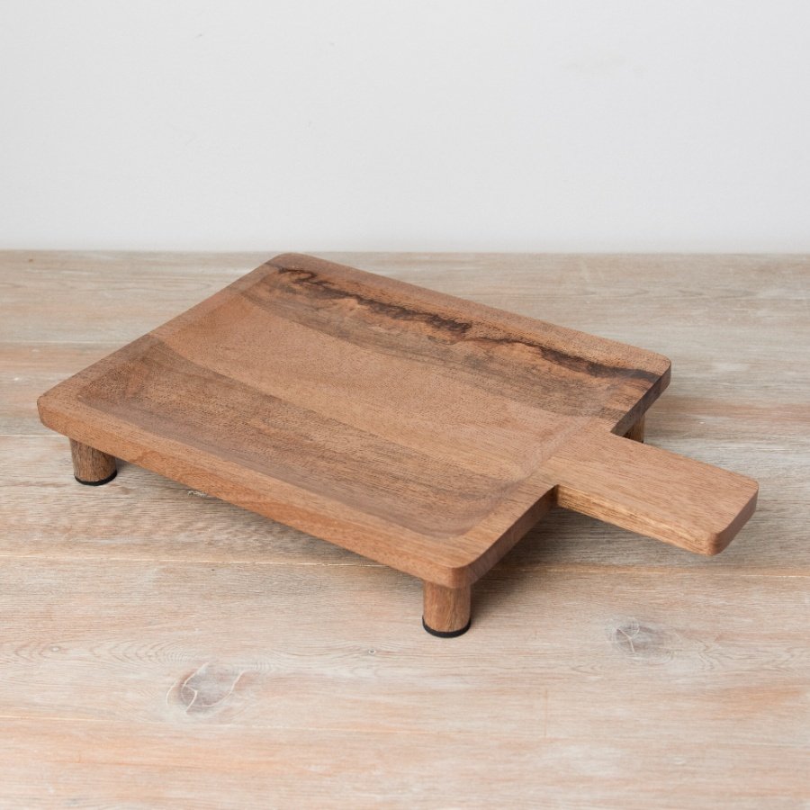 A rustic wooden display board with feet. 