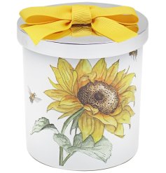 A bright and colourful candle from the Bee - tanicals range. It has a sunflower design around the candle and a chrome