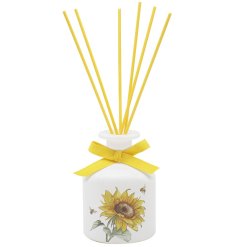 A stylish reed diffuser featuring pretty yellow sunflowers & bees illustrations, perfectly complimented by yellow reeds.
