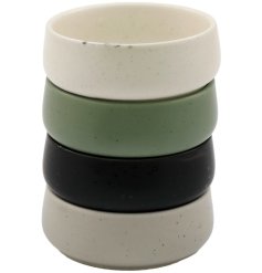 A set of 4 coloured tapas bowls with a faint speckled design. 