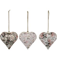 3 assorted floral heart decorations with a jute string hanger.