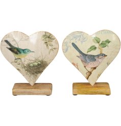 A metal heart shaped ornament with a chunky wooden base, in 2 assorted designs. 