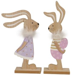 Lively wooden bunny ornaments, hand-painted with a sweet pink and purple outfit and adorned with feather collars.